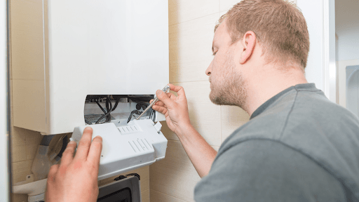 Man troubleshooting or repairing a home internet router.