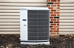 Air conditioning unit installed outside a building, showcasing efficient design for residential comfort in China Spring, TX.